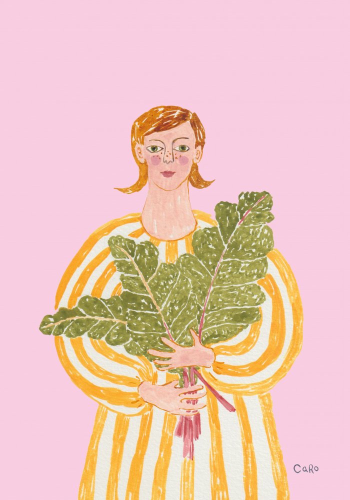 Une femme avec des légumes verts frais - Caroline Roberts