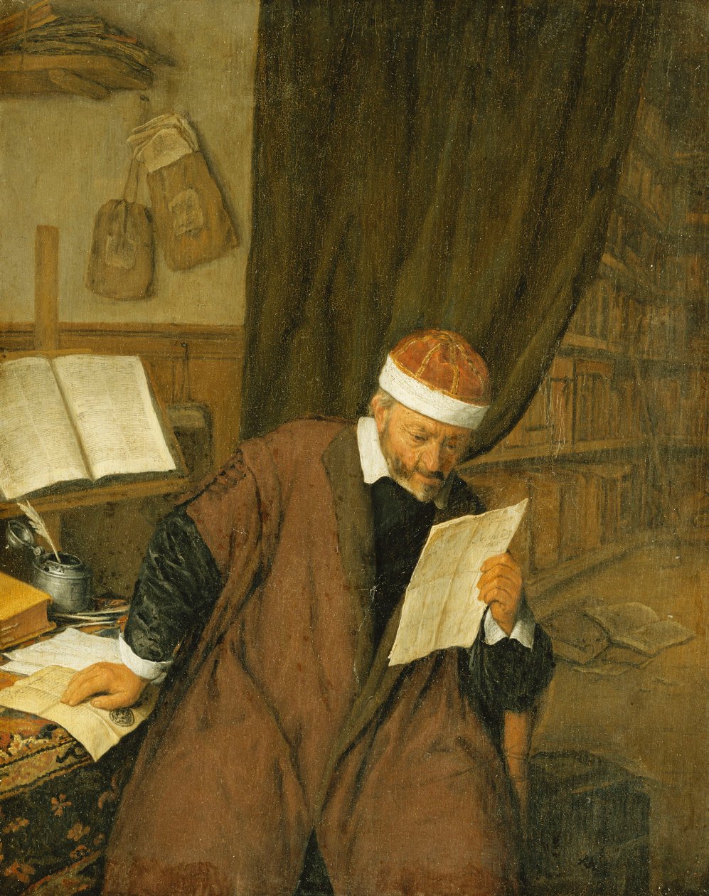 Un avocat assis à un bureau lisant une lettre, une bibliothèque au-delà, 1668 - Adriaen Jansz. van Ostade