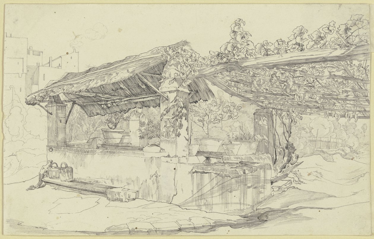 Puits couvert de chaume et lavoir à côté d