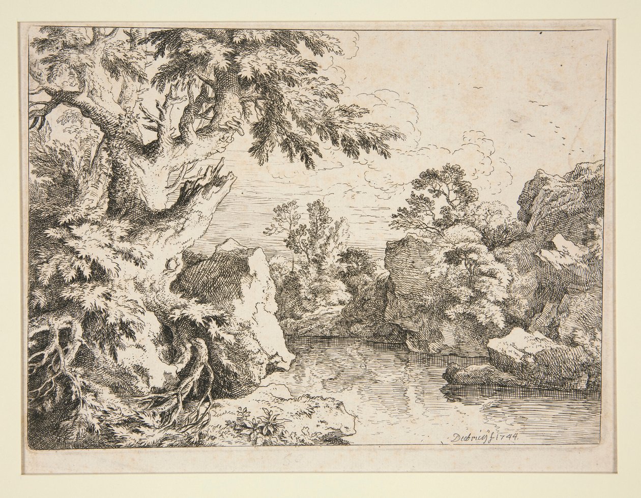 Paysage avec étang bordé de rochers et d