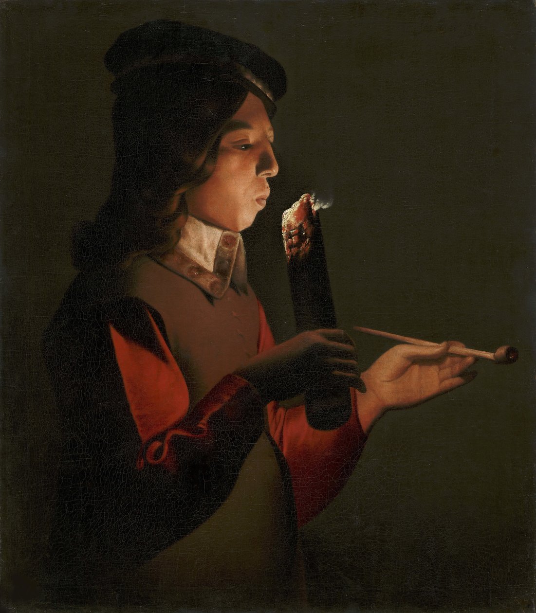 Un jeune garçon avec une pipe, soufflant sur un brandon - Georges de La Tour