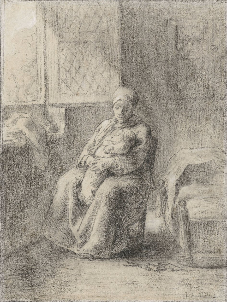 Femme assise avec bébé près d