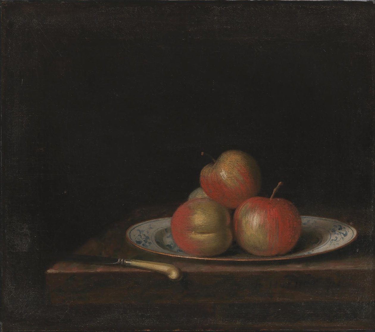 Nature morte avec pommes sur une assiette 