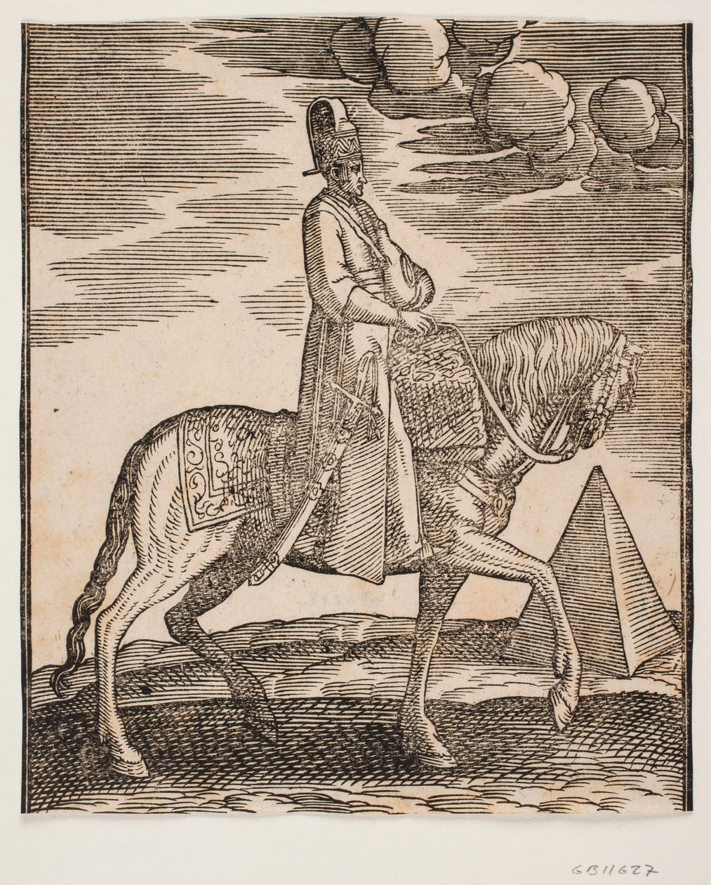 Cavalier avec une flasque autour du cou, profil vers la droite; une épée à son côté droit et des bagages devant lui, drapés sur la selle; à droite, en arrière-plan, une pyramide - Melchior Lorck