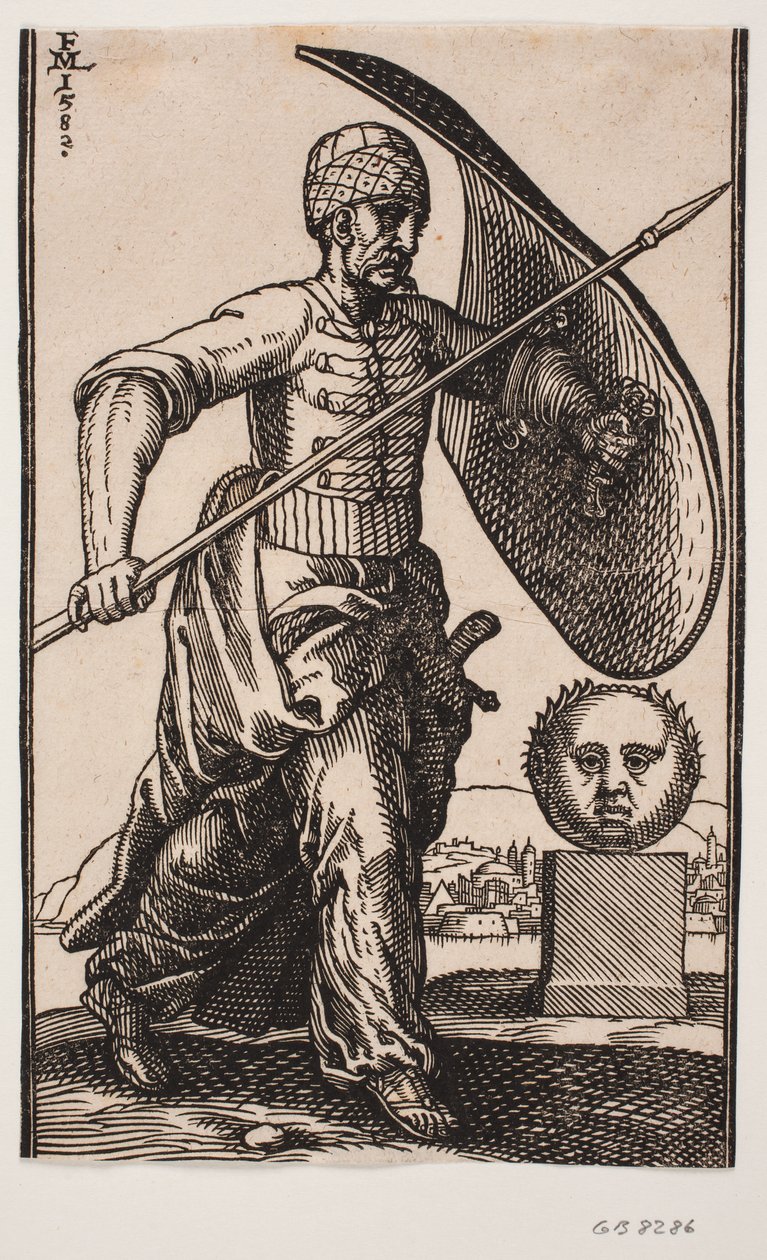 Soldat marchant vers la droite; sur le bras gauche un bouclier courbe, dans la main droite une lance; à droite un socle avec une tête sphérique vue de face; au loin derrière la tête une ville au bord de l