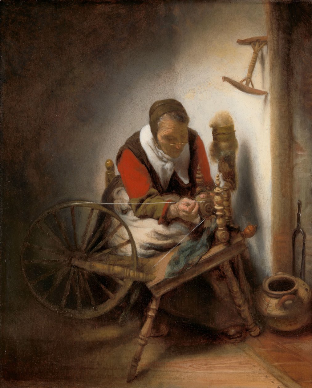 La fileuse, un niddy-noddy accroché au mur - Nicolaes Maes