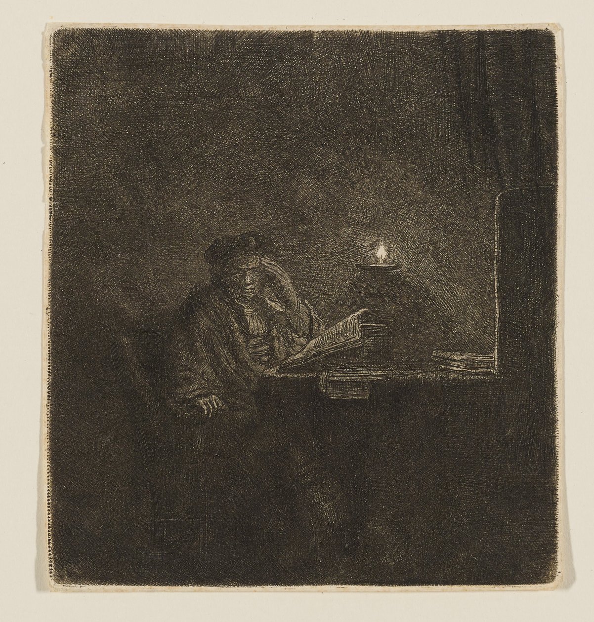 Un étudiant à une table à la lueur d