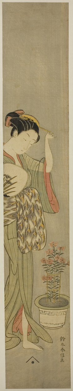 Beauté ajustant sa barrette - Suzuki Harunobu
