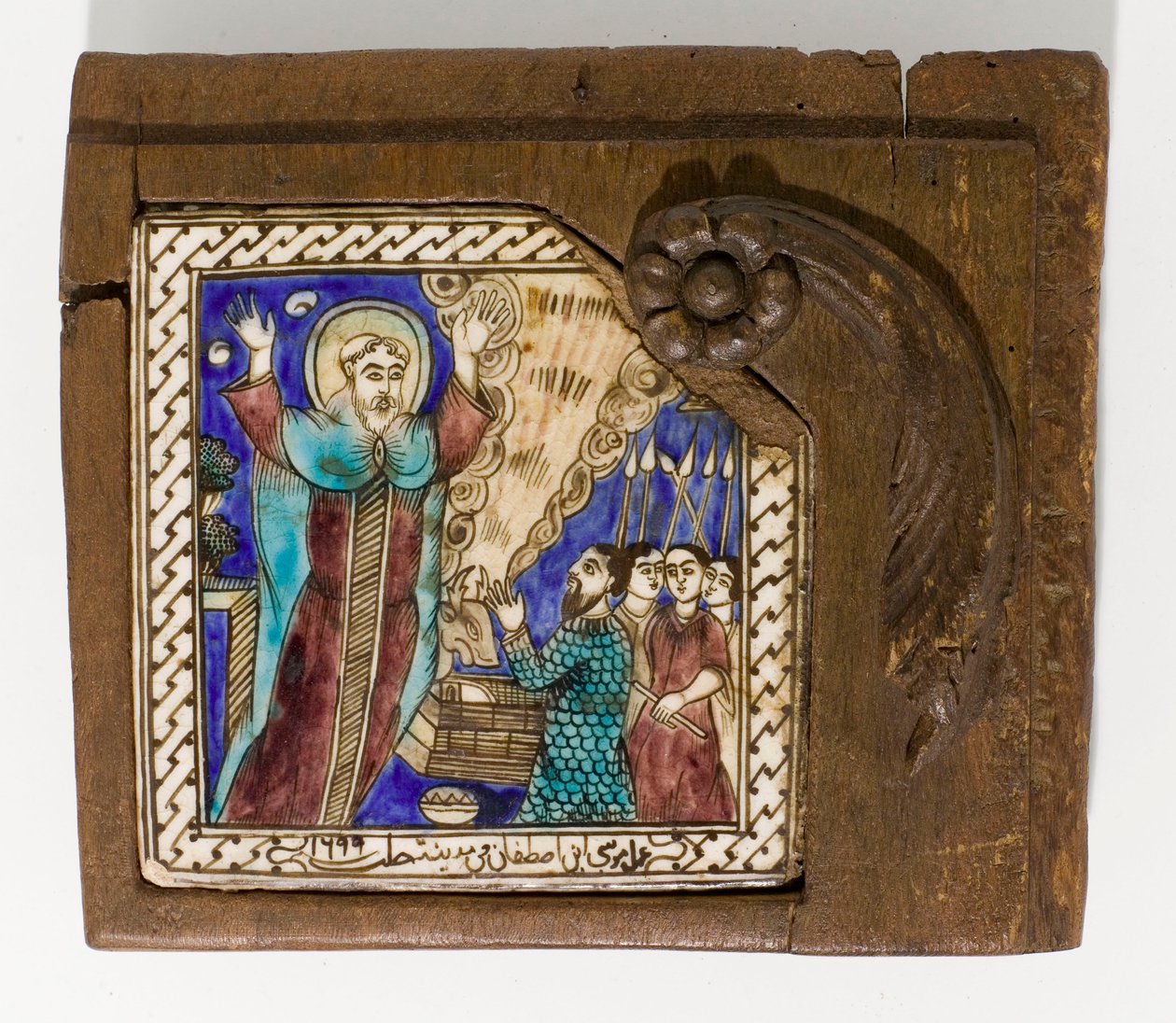 Un carreau de céramique syrien signé et daté, peint en manganèse, bleu et brun, daté 1699 - Syrian School