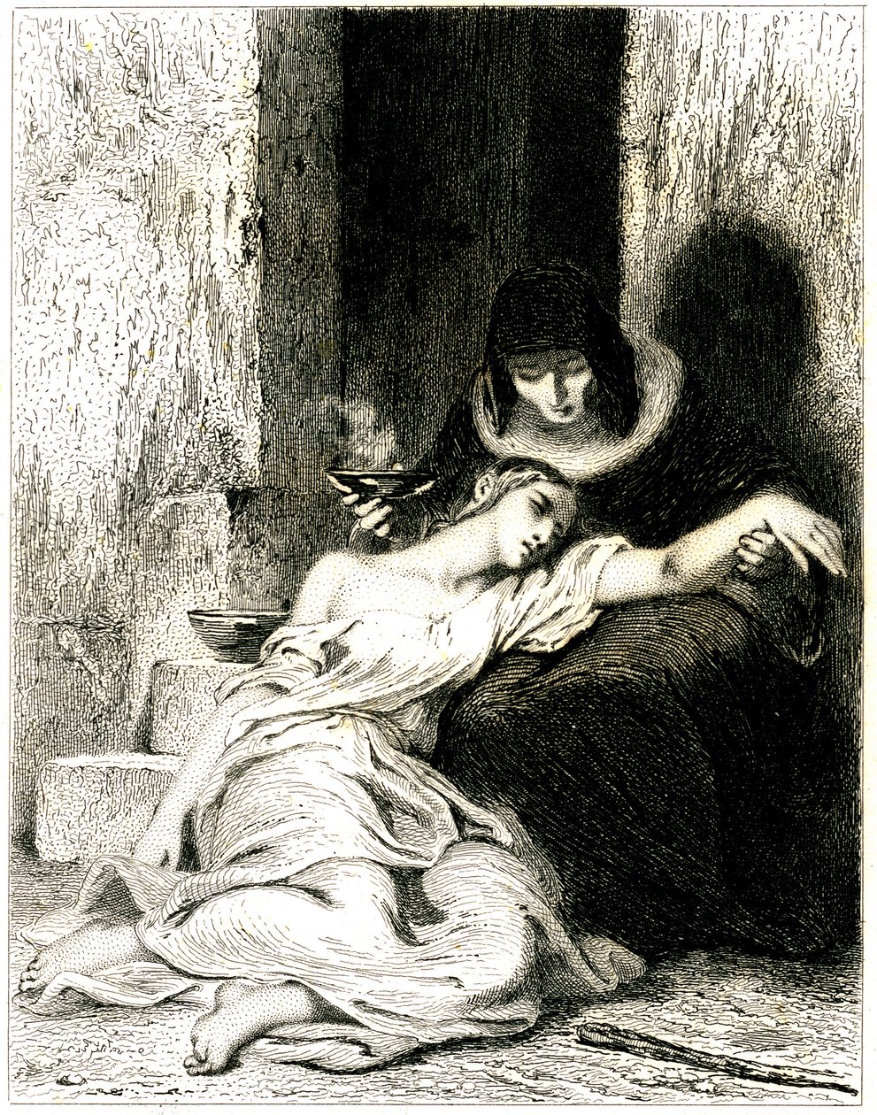Jeune femme visiblement souffrante sur les genoux d