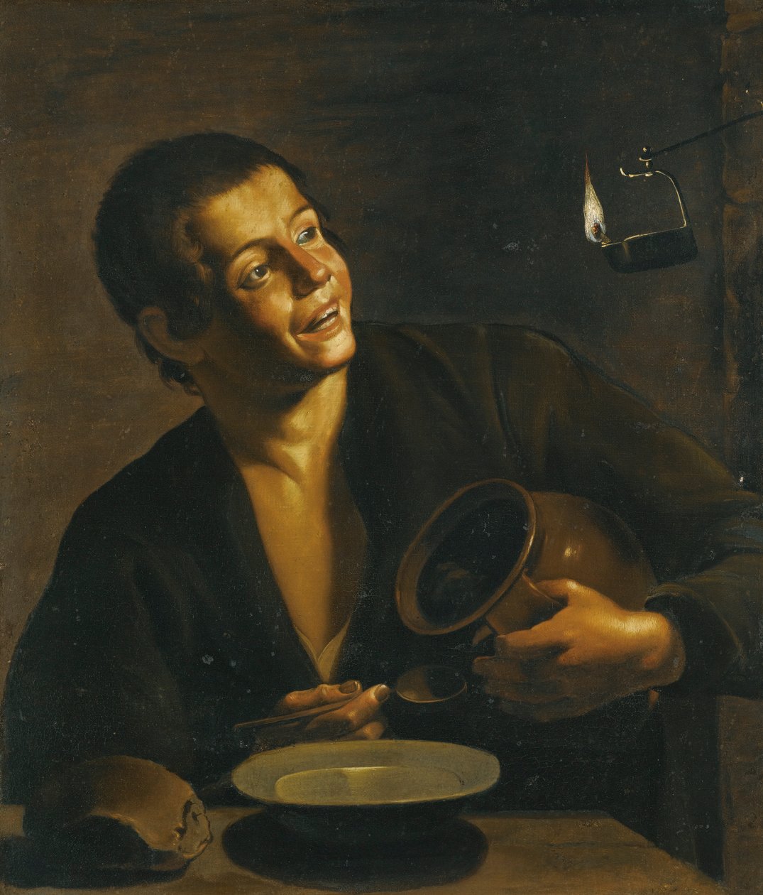Un jeune homme mangeant à la lumière d