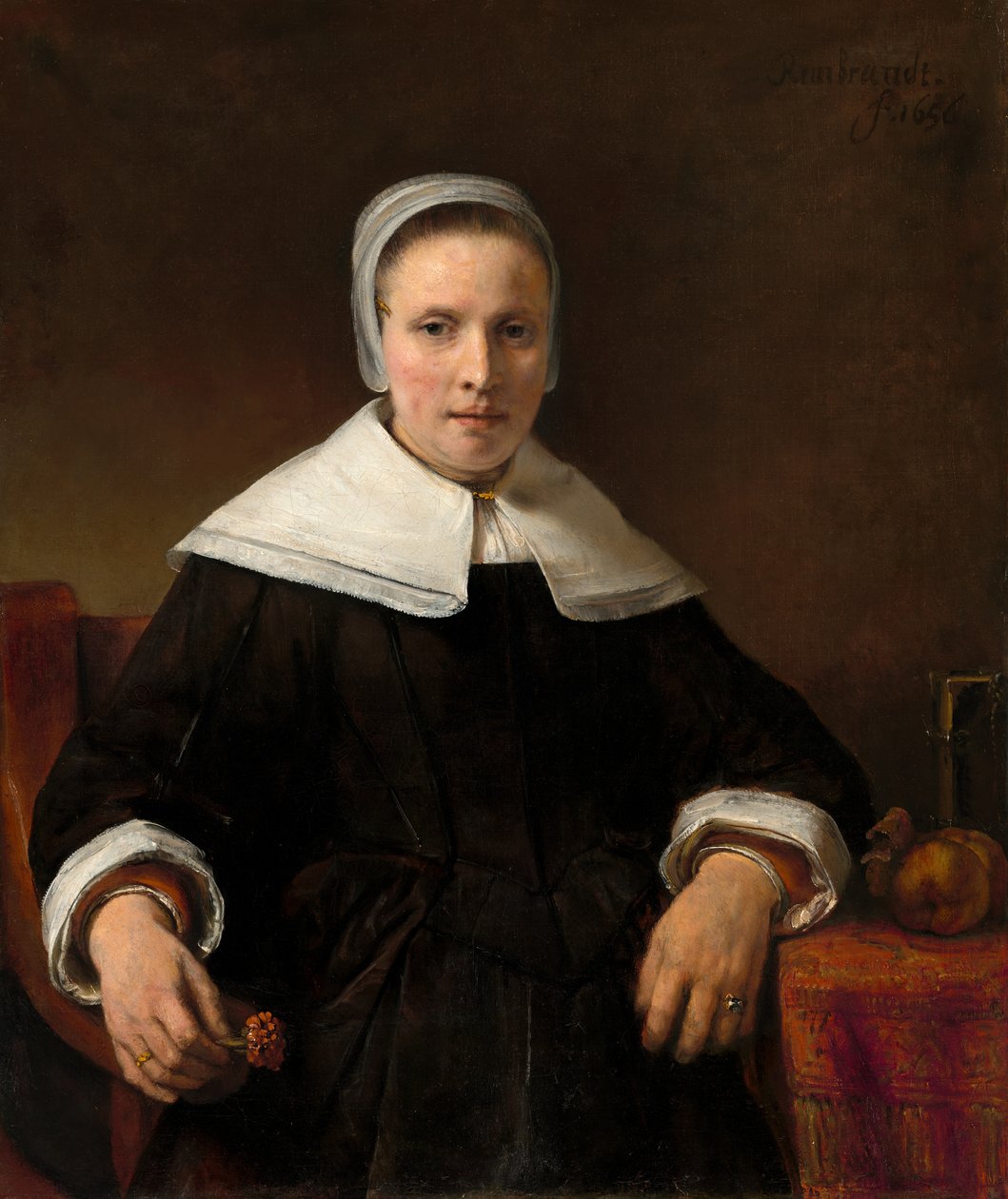 Une femme tenant un œillet - Workshop of Rembrandt