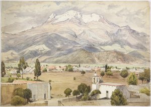Village au premier plan et montagnes derrière