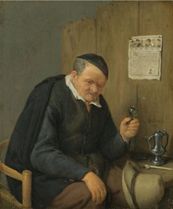 Vieil homme tenant un verre de vin