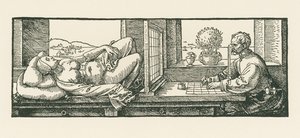 Un homme dessine une femme couchée