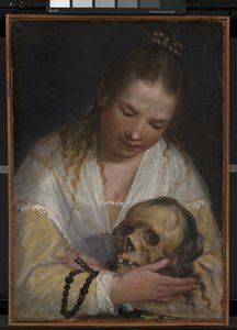Une jeune femme contemplant un crâne