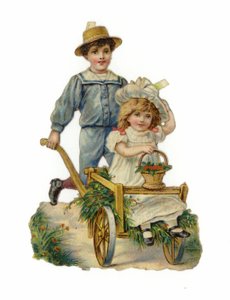 Garçon poussant une charrette à main avec une fille assise à l