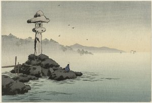 Lanterne sur un rocher au bord de la mer
