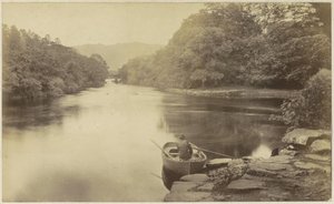 Paysage fluvial en Angleterre, avec un homme en barque au premier plan