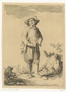 Homme debout avec bâton dans le paysage