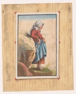 Femme debout aux pieds nus avec un bâton