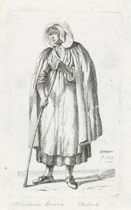 Femme avec une cape et un bâton