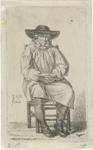 Homme assis avec bâton