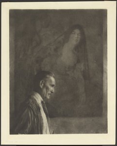 [Homme à la petite moustache soignée, de profil, posé devant un tableau représentant une femme habillée en costume espagnol].