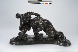 Homme en combat avec un lionceau