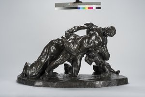 Homme en combat avec un lionceau