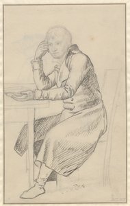 Homme assis à une table