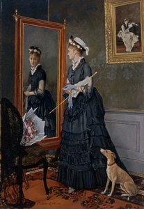 Femme élégante se regardant dans un miroir