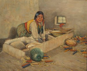 Femme Hopi qui moud le maïs
