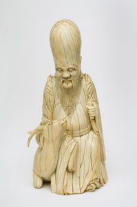 Figure en ivoire sculptée de Shou Xing assis avec un cerf, c.1580-1644