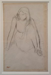 Femme assise au bord de l
