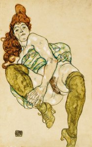 Nu féminin tenant la jambe droite