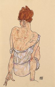Femme assise en sous-vêtements, vue de dos