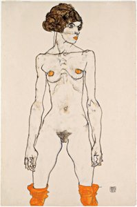 Jeune femme nue debout avec des bas orange