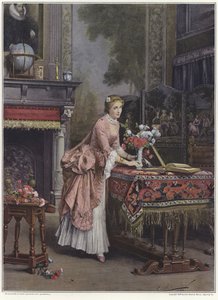 Une femme plaçant un vase de fleurs sur une table