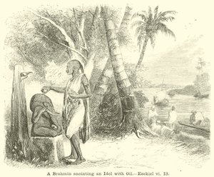 Un brahmane oint une idole avec de l
