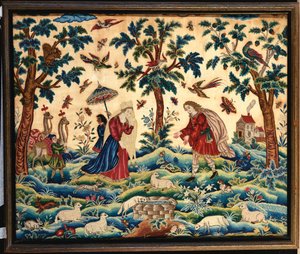 Une fine image en broderie de laine et de soie, probablement représentant la rencontre de Jacob et Rachel au puits