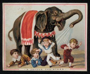 Éléphant arrosant joyeusement des enfants avec de l