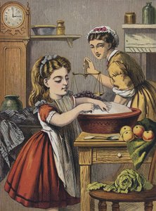 Fille aidant dans la cuisine