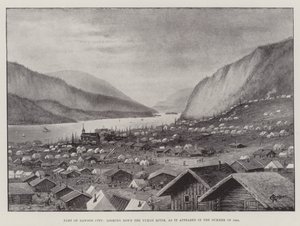 Une partie de Dawson City, vue sur le fleuve Yukon, telle qu