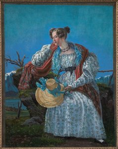 Jeune femme assise dans un paysage norvégien