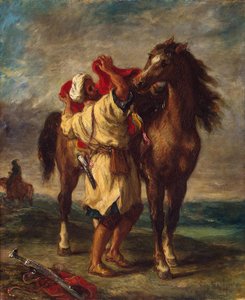Arabe sellant son cheval