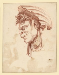 Tête grotesque vue de profil vers la gauche, coiffée d