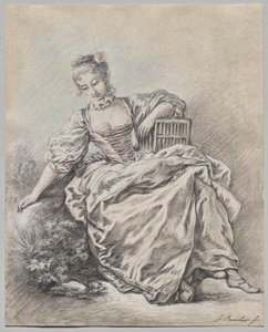 Femme assise tenant une cage à oiseaux