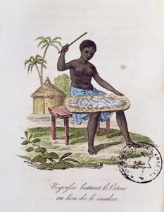 Femme africaine battant du coton