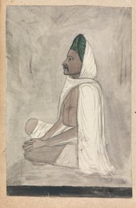 Homme en turban vert assis en tailleur
